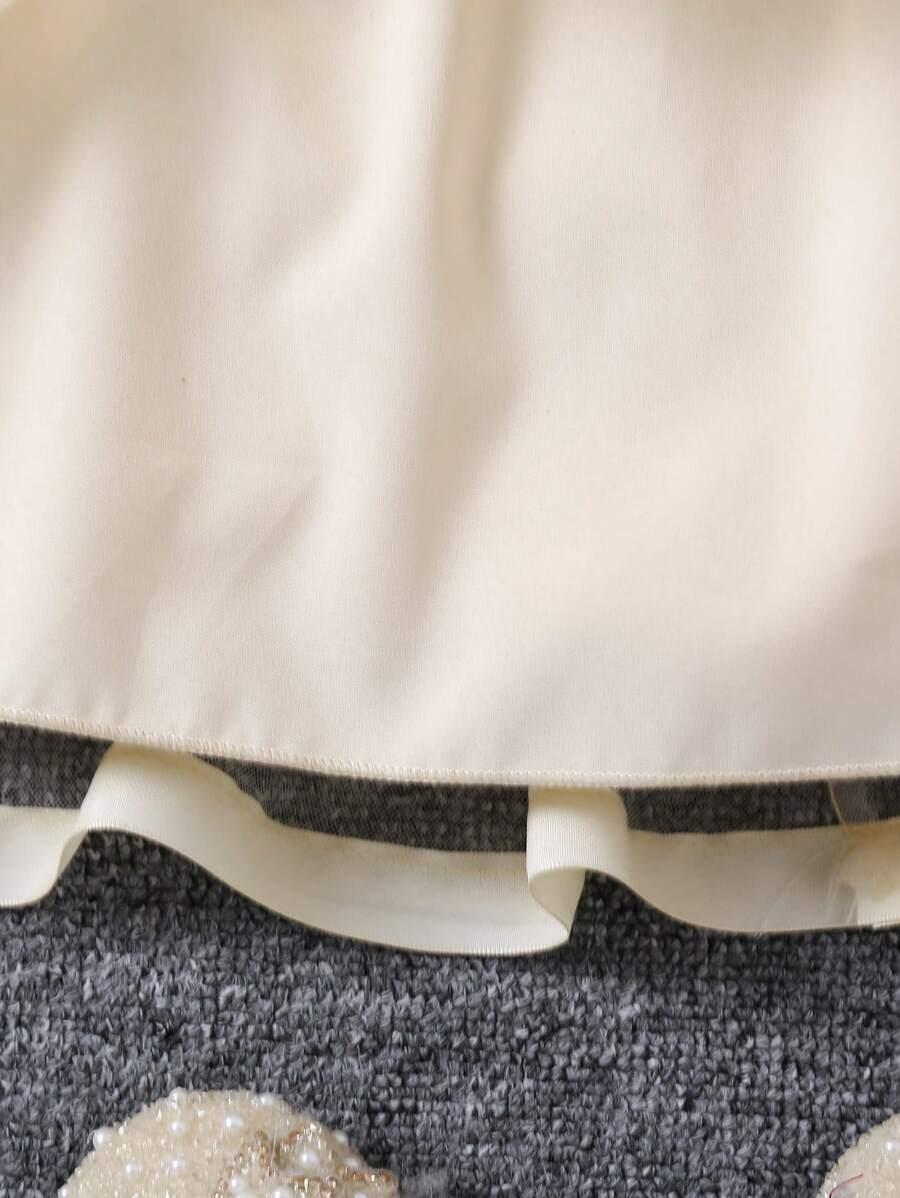 SHEIN KREMOWA SUKIENKA ROZKLOSZOWANA ZDOBIENIE CEKINY KOKARDA S06__104-110