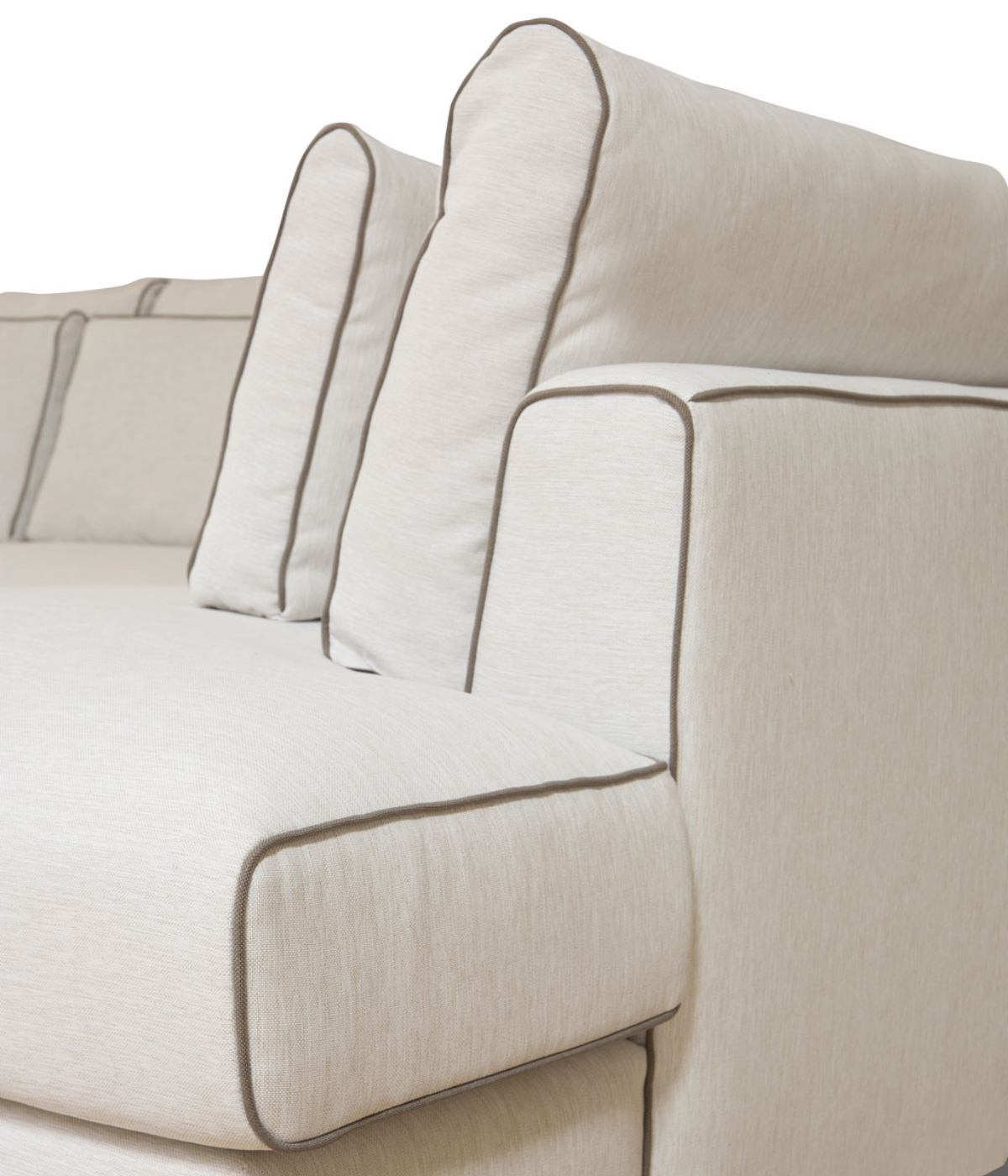 Widok kanapy Myo od boku i zbliżenie na kontrastową lamówkę, która podkreśla kształt mebla