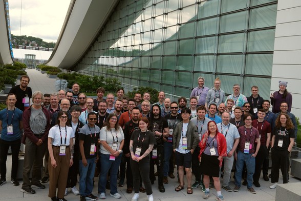 A large group of Python core developers and contributors at Python Language Summit 2025, outdoor at David L. Lawrence convention center