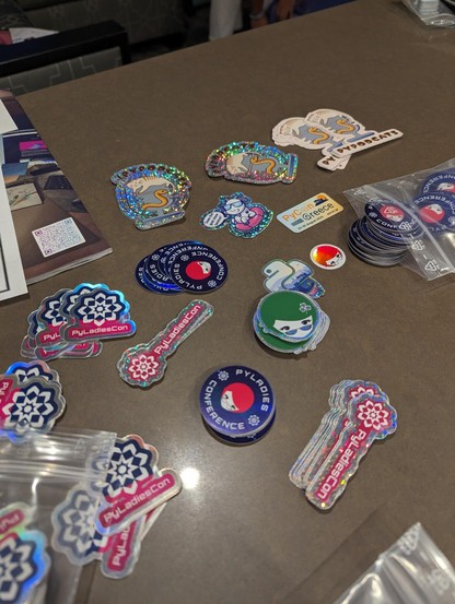 Stacks of stickers on a table
Stickers from PyLadiesCon, PyPodcats, PyLadies Dublin, PyCon Greece