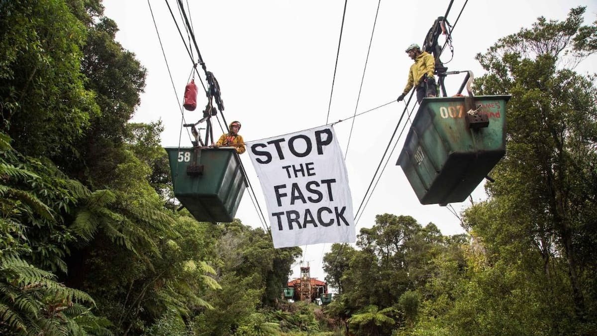 Protesters from 350 Aotearoa in the coal buckets at the Stockton Mine on the Denniston Plateau, where they spent two nights last week.