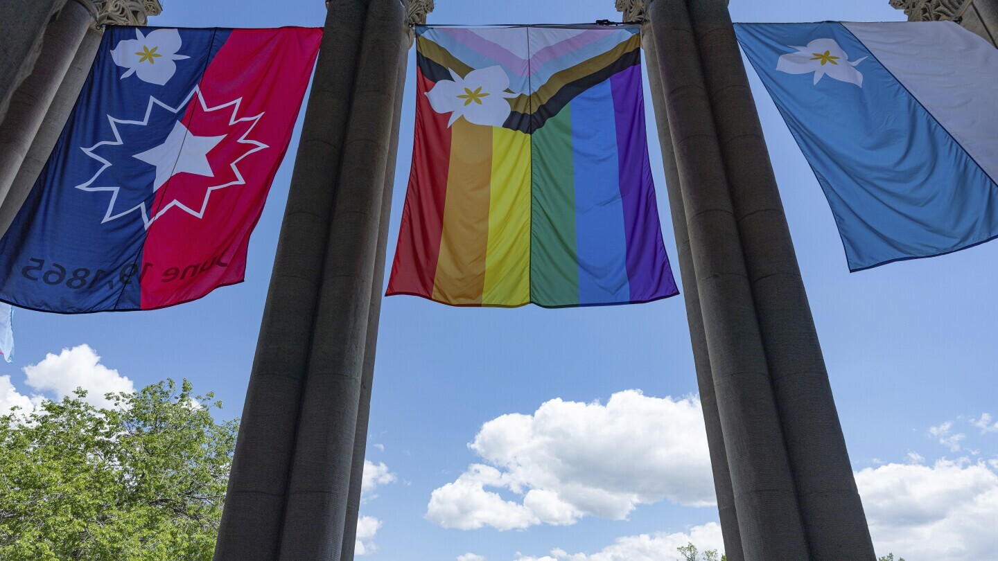 The newly adopted city flags are displayed at the Salt Lake City and County building showing support for LGBTQ+ in defiance of their state's Republican controlled Legislature, Wednesday, May 7, 2025, in Salt Lake City. (AP Photo/Melissa Majchrzak)