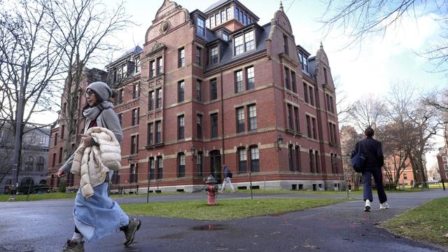 People walk between buildings, Dec. 17, 2024, on the campus of Harvard University in Cambridge, Mass. (AP Photo/Steven Senne, File)