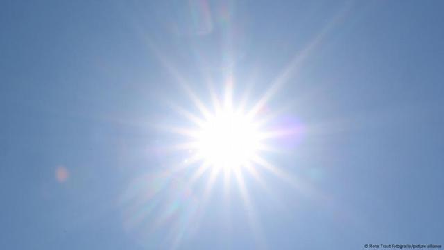 A bright sun in a blue sky over Siegerland in Germany on May 19, 2025
