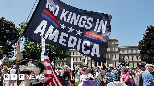 People take part in a "No Kings" protest outside the Michigan Capitol in Lansing, Michigan, on 14 June 2025 as US President Donald Trump presides over a military parade in Washington, DC.