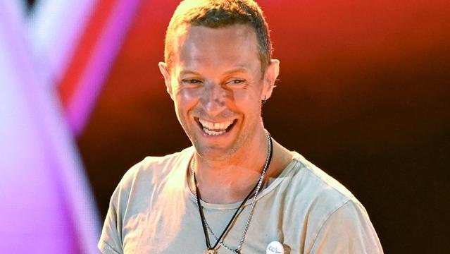 LAS VEGAS, NEVADA - SEPTEMBER 21: Chris Martin of Coldplay performs onstage during the 2024 iHeartRadio Music Festival at T-Mobile Arena on September 21, 2024 in Las Vegas, Nevada. (Photo by Bryan Steffy/Getty Images)